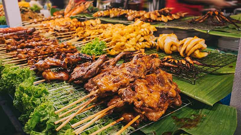 Street food Thailand Pork satay Grilled squids local Food vendor